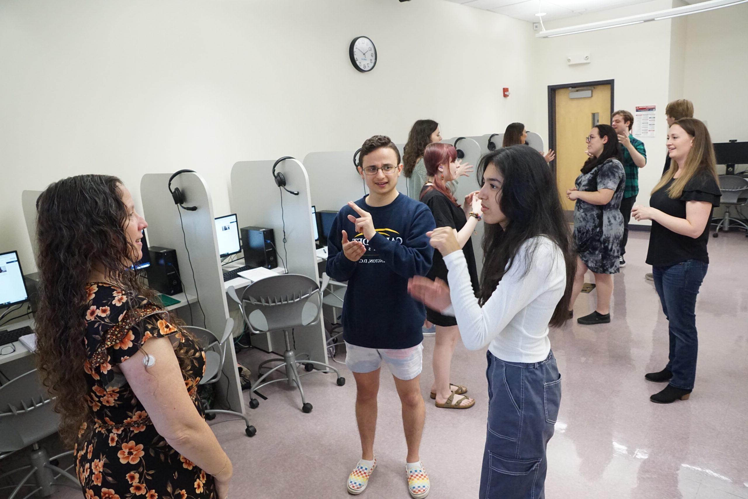 students practicing ASL